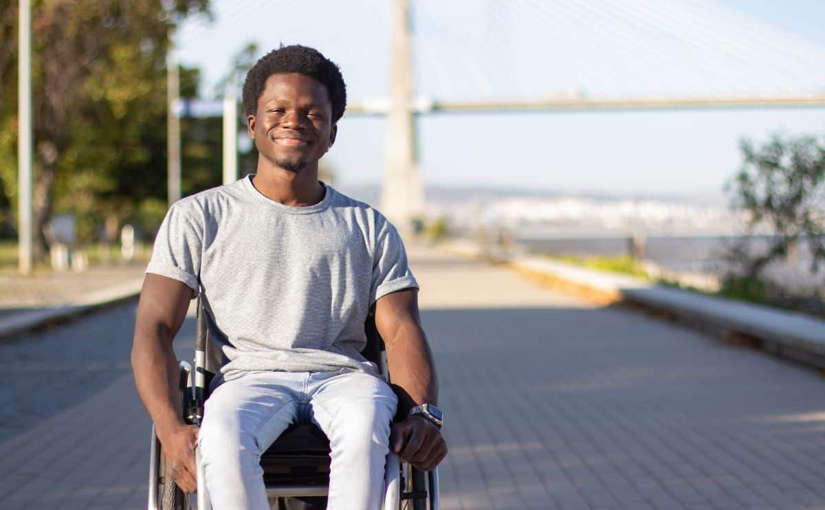 Picture of man in wheelchair smiling at camera